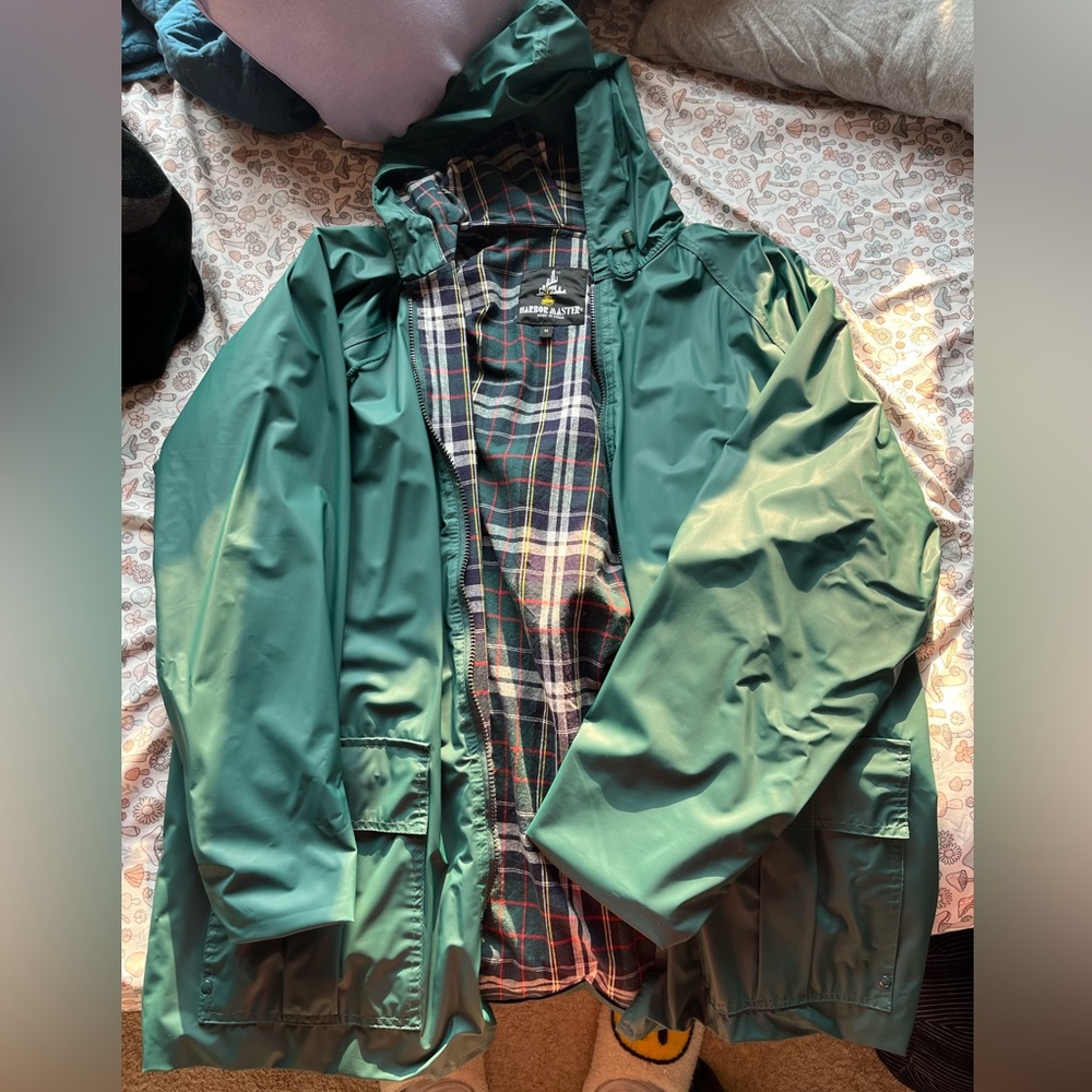 The medium fits like a large and is raincoat material